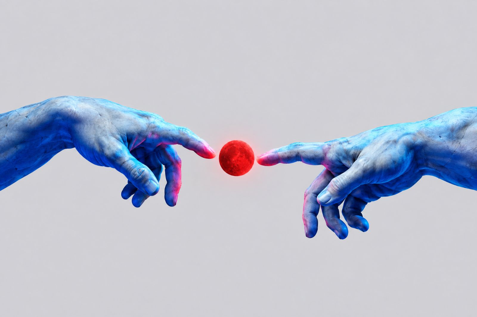 Hands placing a red sphere